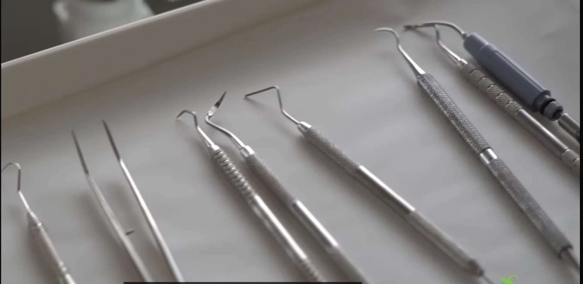 Dental examination instruments arranged on a tray at Elite Smiles